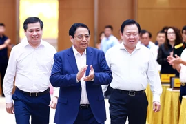 Thủ tướng Phạm Minh Chính đến Hội nghị Thủ tướng Chính phủ làm việc với doanh nghiệp nhà nước. (Ảnh: Dương Giang/TTXVN)