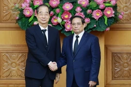 Thủ tướng Phạm Minh Chính tiếp Thủ tướng Hàn Quốc Han Duck Soo. (Ảnh: Dương Giang/TTXVN)