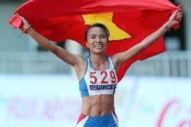 VĐV Phạm Thị Bình xuất sắc đoạt Huy chương Vàng nội dung Marathon nữ 42km. (Ảnh: Quang Nhựt/TTXVN) 