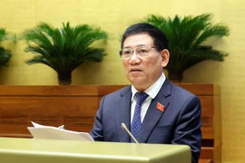 Bộ trưởng Bộ Tài chính Hồ Đức Phớc, thừa ủy quyền của Thủ tướng Chính phủ trình bày Báo cáo về công tác thực hành tiết kiệm, chống lãng phí năm 2023. (Ảnh: TTXVN)
