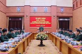 Quang cảnh buổi làm việc giữa Đại tướng Phan Văn Giang và lãnh đạo Tổng cục Công nghiệp Quốc phòng. (Ảnh: Hồng Pha/TTXVN phát)