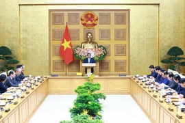 Thủ tướng Phạm Minh Chính tọa đàm với các doanh nghiệp Trung Quốc tiêu biểu trong lĩnh vực phát triển kinh tế xanh, kinh tế số. (Ảnh: Dương Giang/TTXVN)