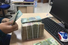 Giá khởi điểm được chào trong phiên đấu giá là 15.900 đồng/cổ phần. (Ảnh: Vietnam+)