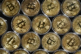 Đồng tiền kỹ thuật số Bitcoin. (Ảnh: AFP/TTXVN)