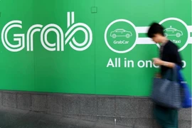 Biểu tượng Grab tại văn phòng ở Singapore. (Ảnh: AFP/TTXVN)