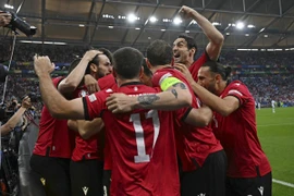 Gruzia ăn mừng kỳ tích giành quyền vào vòng 1/8 EURO 2024 ngay trong lần đầu tiên được dự Vòng chung kết EURO (Nguồn: AFP/TTXVN)