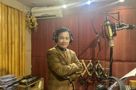 Nhạc sỹ Nguyễn Quang Long đã có 30 năm gắn bó với âm nhạc dân tộc. (Ảnh: CTV/Vietnam+)