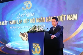 Phó Thống đốc Ngân hàng Nhà nước Phạm Tiến Dũng phát biểu tại lễ kỷ niệm. (Ảnh: Vietnam+)