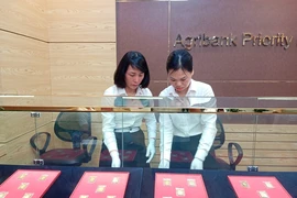 Agribank triển khai tiện ích đăng ký mua vàng miếng SJC trực tuyến. (Ảnh: Vietnam+)