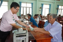 Nguồn vốn ưu đãi được chi nhánh Ngân hàng Chính sách Xã hội tỉnh Tây Ninh giải ngân tại xã giúp hộ vay tiết kiệm thời gian, chi phí đi lại. (Ảnh: Vietnam+)