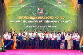 Đại diện lãnh đạo Đàng và Nhà nước chụp ảnh lưu niệm tại Chương trình. (Ảnh: Vietnam+)