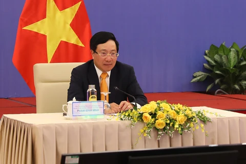 Phó Thủ tướng, Bộ trưởng Bộ Ngoại giao Phạm Bình Minh chủ trì phiên họp. (Ảnh: Lâm Khánh/TTXVN)
