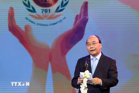 Thủ tướng Nguyễn Xuân Phúc, Trưởng ban Chỉ đạo quốc gia khắc phục hậu quả bom mìn và chất độc hoá học sau chiến tranh ở Việt Nam phát biểu. (Ảnh: Thống Nhất/TTXVN) 