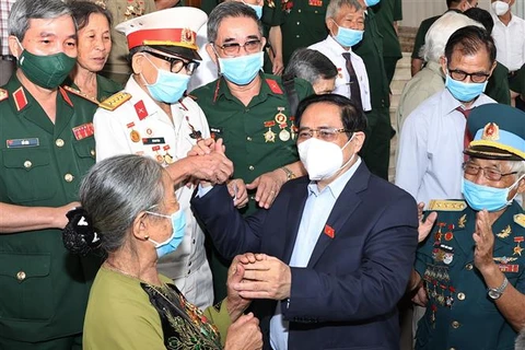 Thủ tướng Phạm Minh Chính gặp mặt, tri ân đại biểu người có công với cách mạng nhân kỷ niệm Ngày thương binh, liệt sỹ, hồi tháng 7/2021. (Ảnh: Dương Giang/TTXVN)