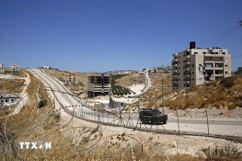 Những tòa nhà của người Palestine tại thành phố Sur Baher, miền Đông Jerusalem, ngày 19/7. (Ảnh: AFP/TTXVN)