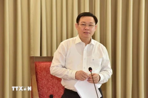 Bí thư Thành ủy Hà Nội Vương Đình Huệ chủ trì hội nghị. (Nguồn: TTXVN)