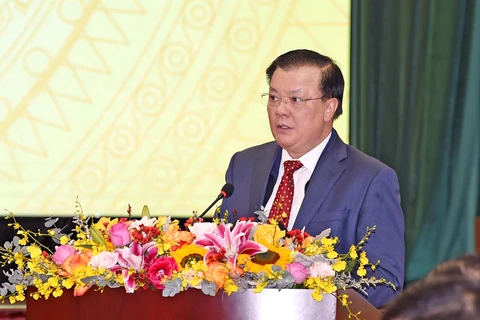 Bộ trưởng Bộ Tài chính Đinh Tiến Dũng phát biểu tại hội nghị, ngày 8/1. (Ảnh: Vietnam+)