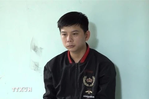 Đối tượng Nguyễn Quốc Huy tại cơ quan điều tra. (Ảnh: TTXVN phát)