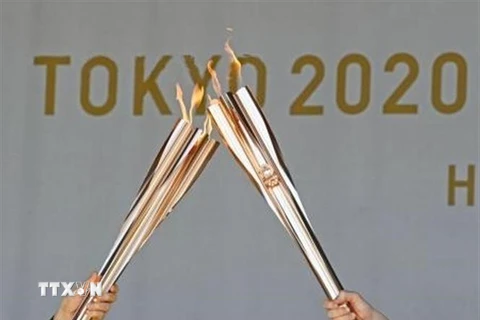 Lễ rước đuốc Olympic tại Tokyo, Nhật Bản, ngày 18/7. (Ảnh: Kyodo/TTXVN)