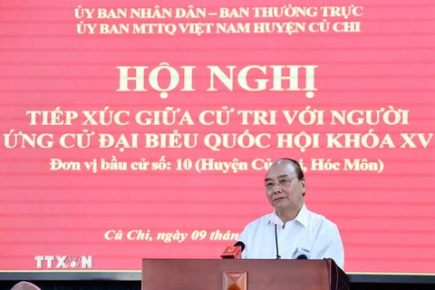 Chủ tịch nước Nguyễn Xuân Phúc trình bày chương trình hành động tại buổi tiếp xúc cử tri huyện Củ Chi. (Ảnh: Thống Nhất/TTXVN)