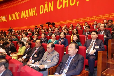 Các đại biểu dự ngày làm việc thứ hai Đại hội XIII của Đảng. (Ảnh: TTXVN) 