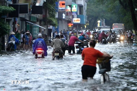 Nước ngập trên đường Nguyễn Văn Khối, quận Gò Vấp, Thành phố Hồ Chí Minh. (Ảnh: Hồng Giang/TTXVN) 