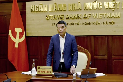 Thống đốc Ngân hàng Nhà nước Lê Minh Hưng phát biểu tại Hội nghị trực tuyến. (Ảnh: CTV)
