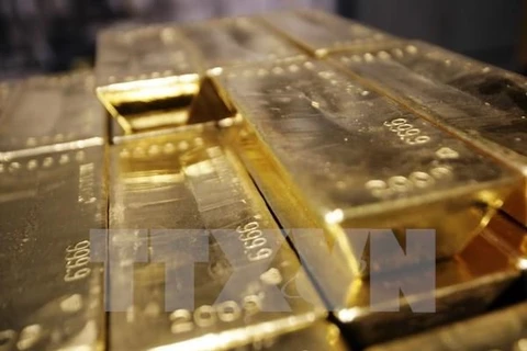 Đà tăng của giá vàng bị kiềm chế bởi sự mạnh lên của đồng USD