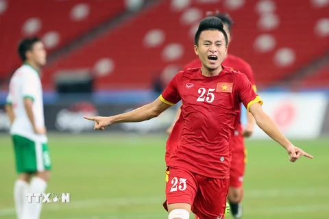 Tiền vệ Huy Toàn ăn mừng sau khi ghi bàn thắng cho U23 Việt Nam. (Ảnh: Quốc Khánh/TTXVN)
