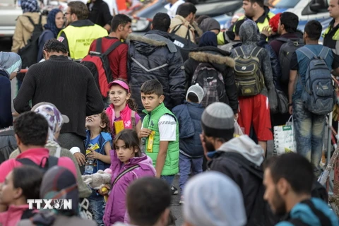 Người di cư tại nhà ga ở Munich ngày 12/9. (Ảnh: AFP/TTXVN)