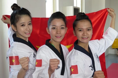 Đội tuyển taekwondo nữ giành huy chương vàng. (Ảnh: TTXVN)