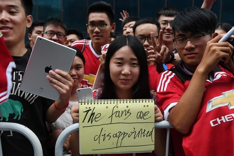 Cổ động viên Trung Quốc lỡ cơ hội xem trực tiếp M.U thi đấu. (Nguồn: AFP/Getty Images)