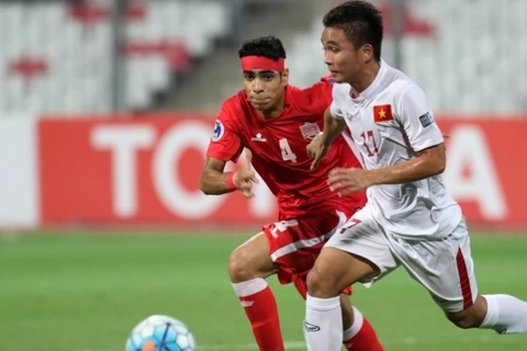 Trần Thành (áo trắng) giúp U19 Việt Nam giành chiến thắng trước U19 Baharin. (Nguồn: AFC)