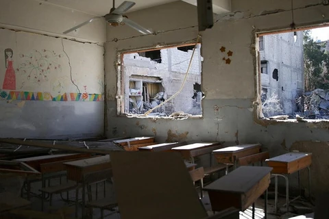 Cảnh một lớp học ở Syria bị tấn công. (Nguồn: Reuters)