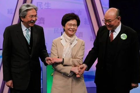 Ba ứng cử viên (từ trái sang) Tăng Tuấn Hoa, Lâm Trịnh Nguyệt Nga và Hồ Quốc Hưng. (Nguồn: AP)