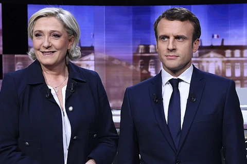 Hai ứng cử viên Macron và Le Pen. (Nguồn: Reuters)