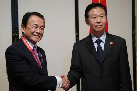 Bộ trưởng Tài chính nước chủ nhà Taro Aso và người đồng cấp Trung Quốc Tiêu Tiệp. (Nguồn: Reuters)