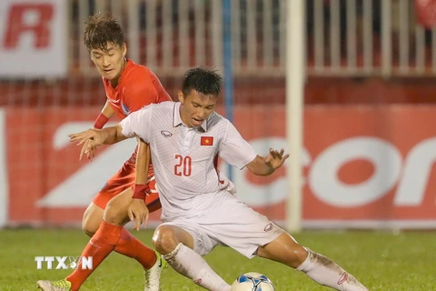 Việt Nam và Hàn Quốc cùng giành vé dự vòng chung kết U23 châu Á. (Ảnh: Quang Nhựt/TTXVN)