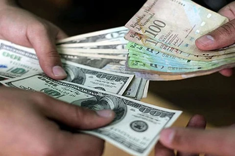 Người dân Venezuela sẽ không lệ thuộc vào đồng USD nữa. (Nguồn: noticias24.com)