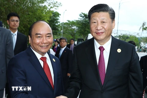 Thủ tướng Nguyễn Xuân Phúc và Tổng Bí thư, Chủ tịch Trung Quốc Tập Cận Bình. (Ảnh: TTXVN)