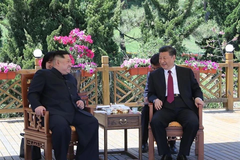 Nhà lãnh đạo Triều Tiên Kim Jong-un và Chủ tịch Trung Quốc Tập Cận Bình. (Nguồn: AFP)
