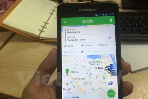 Ứng dụng phần mềm gọi xe của Grab. (Ảnh: Việt Hùng/Vietnam+)