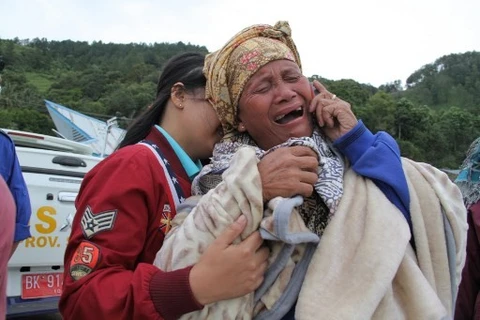 Người thân của các nạn nhân. (Nguồn: AFP)