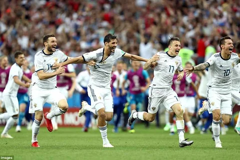 Niềm vui của cầu thủ Nga sau khi đánh bại Tây Ban Nha. (Nguồn: Getty Images)