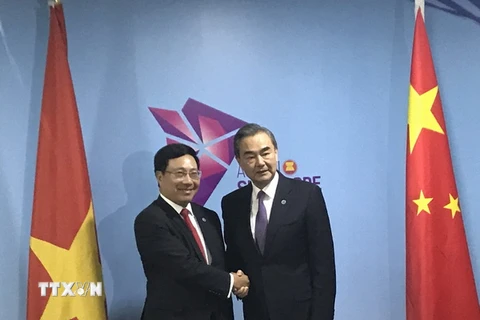Phó Thủ tướng, Bộ trưởng Ngoại giao Phạm Bình Minh gặp Ủy viên Quốc vụ, Bộ trưởng Ngoại giao Trung Quốc Vương Nghị. (Ảnh: TTXVN phát)