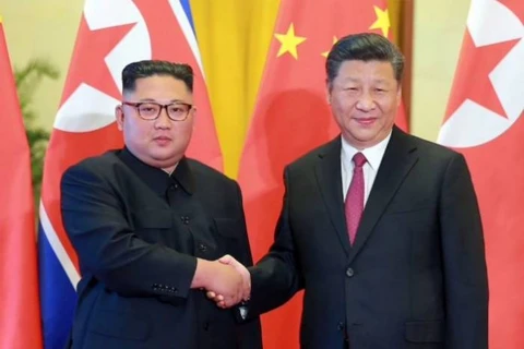 Chủ tịch Trung Quốc Tập Cận Bình và Nhà lãnh đạo Triều Tiên Kim Jong-un trong cuộc gặp gần đây. (Nguồn: AFP)