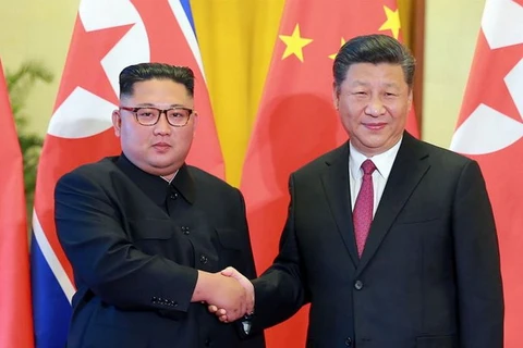 Nhà lãnh đạo Triều Tiên Kim Jong-un và Chủ tịch Trung Quốc Tập Cận Bình trong cuộc gặp gần đây. (Nguồn: AFP)