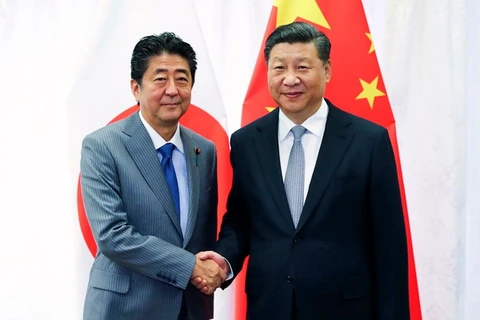 Thủ tướng Nhật Bản Shinzo Abe và Chủ tịch Trung Quốc Tập Cận Bình. (Nguồn: AP)