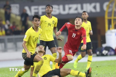 Quảng Hải sẽ cùng đồng đội vượt qua Malaysia để vô địch AFF Suzuki Cup 2018. (Ảnh: Hoàng Linh/TTXVN)
