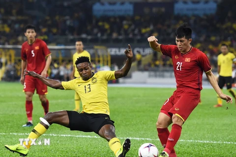 Đình Trọng (số 21) có thể sẽ được gọi trở lại đội tuyển dự Asian Cup 2019. (Ảnh: AFP/TTXVN)